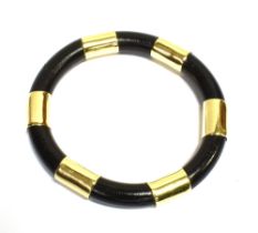 DESIGNER 9CT GOLD & BLACK RESIN BANGLE Handmade black resin bangle, decorated with 14.9mm wide 9ct