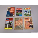 A collection of football albums and pocket guides