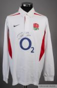 A white England rugby jersey signed by Martin Johnson
