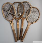 Four wooden framed tennis racquets,