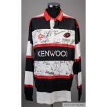 A black, white and red Saracens autographed rugby jersey