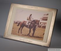 A signed Lester Piggott presentation photograph in silver Asprey frame