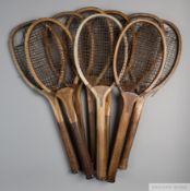 A collection of 14 wooden framed convex-wedge tennis racquets,