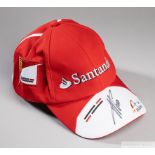 Fernando Alonso signed red and white Ferrari F1 cap