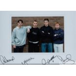 A colour photograph of a youthful Gary Neville, Nicky Butt, David Beckham and Paul Scholes