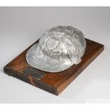 An unusual full size white-metal copy of Nobby Stiles's 1966 World Cup cap