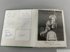 An album of autographed cricket cards