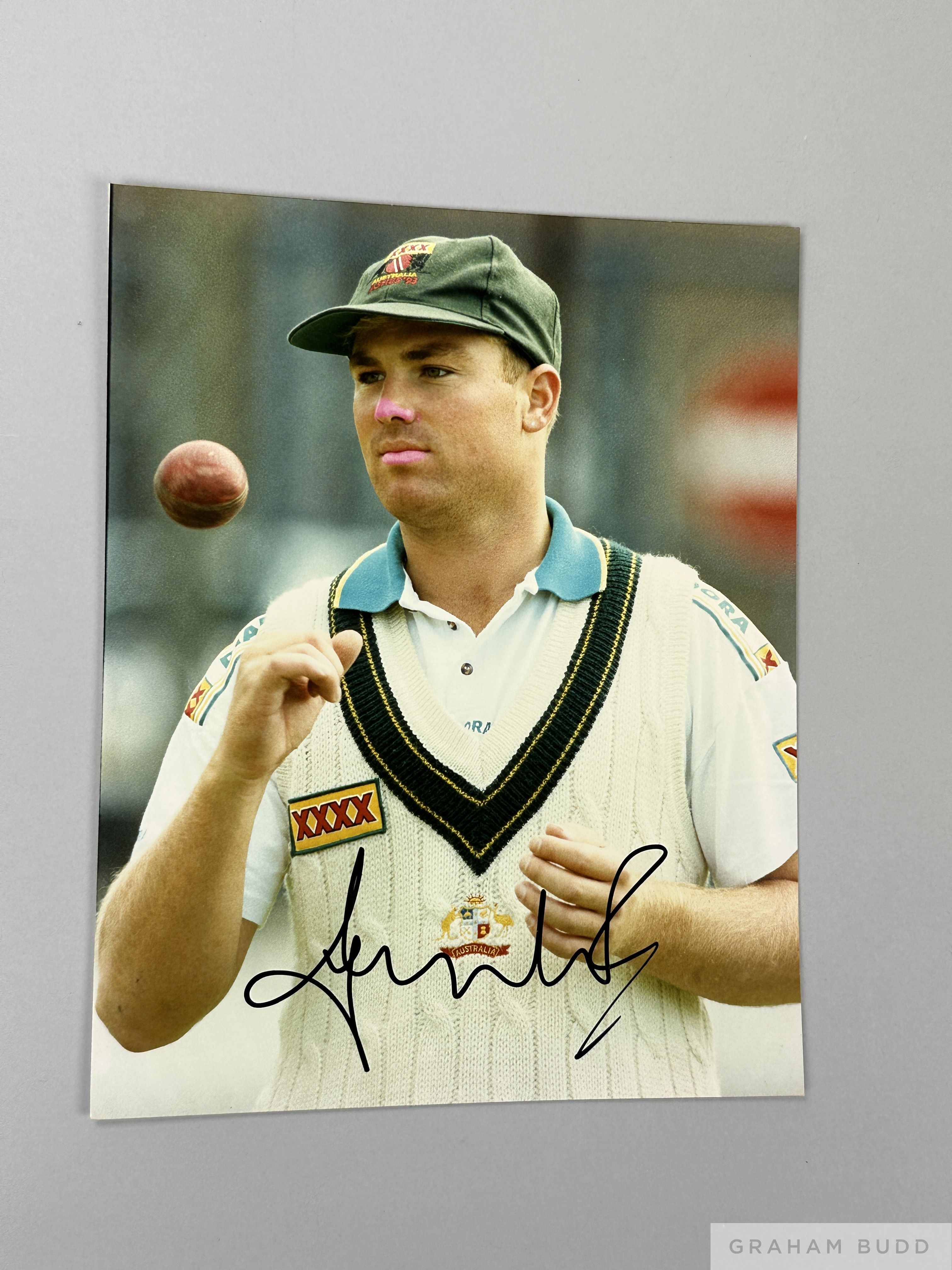 Excellent cricket coloured signed photograph of Shane Warne,