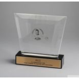 A trophy presented to Pelé composed of a clear acrylic plaque etched with a portrait of Pelé