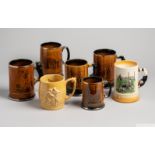 Group of five ceramic and pottery rugby tankards,