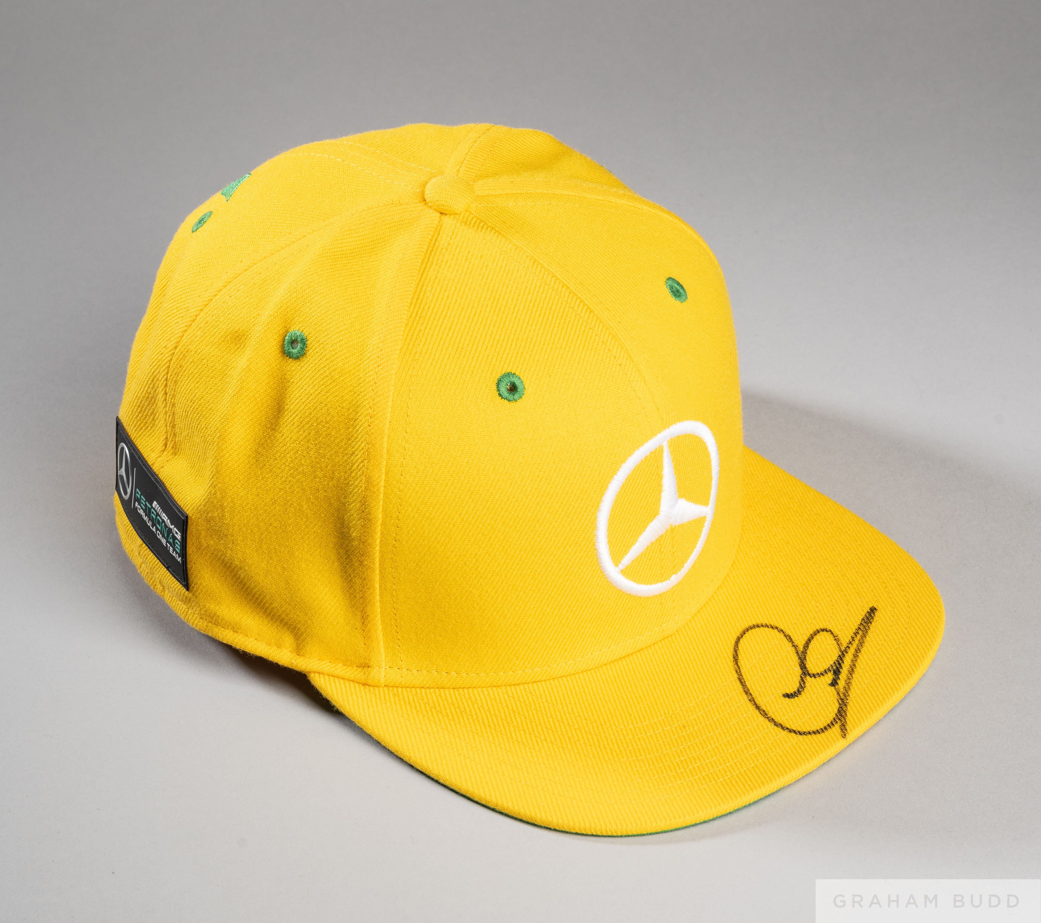 Lewis Hamilton signed yellow and green Mercedes AMG Petronas Motorsport cap