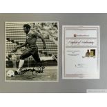 A black and white autographed photograph of Pele in Cosmos strip