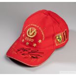 Michael Schumacher signed 2002 red DVAG cap