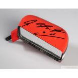 An original Ferrari carbon fiber wing mirror autographed by Michael Schumacher