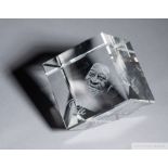 A crystal memento owned by Pelé featuring an internal laser-etched portrait of himself above the nam