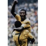 A large colour portrait photograph of Pele celebrating his legendary "Goal of the century"
