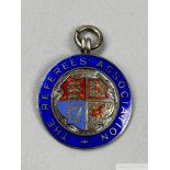 A silver and enamel 1961 Referees' Association medal