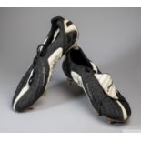 A pair of black and white Umbro size 10.5 exo skeleton football boots