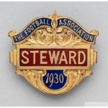 A gilt-metal and enamel 1930 F.A. Cup Steward's badge