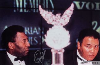 Colour reproduction photograph of Pele and Muhammad Ali