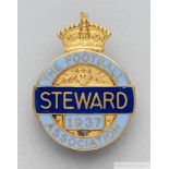 A gilt-metal and enamel 1937 F.A. Steward's badge