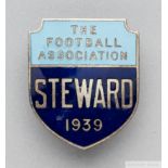 A gilt-metal and enamel 1939 F.A. Cup Steward's badge