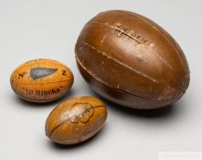 Miniature tinplate rugby ball, stamped SOUVENIR NZ "All Blacks"