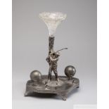 A white metal ink stand depicting a Golfer, circa 1880