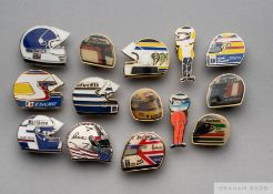 Twelve various enamel F1 lapel badges formed as racing helmets
