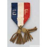 A 1910 blue, white and red E v. F stewards badge