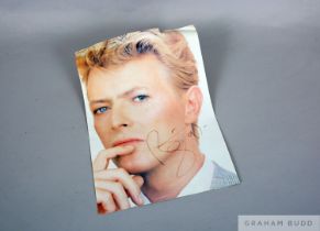 A large hand signed colour David Bowie image