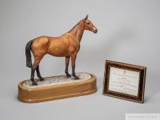 Royal Worcester porcelain model of the racehorse Arkle modelled by Doris Lindner, on wooden stand,