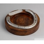 From the Pat Eddery Collection: a racing plate worn by Pasty in 1975, set on a wooden ashtray with