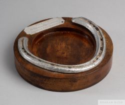 From the Pat Eddery Collection: a racing plate worn by Pasty in 1975, set on a wooden ashtray with