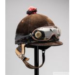 Lester Piggott's signed work helmet and goggles, signed on the neck leather, by McHal, the skull cap