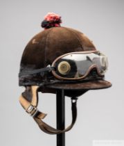 Lester Piggott's signed work helmet and goggles, signed on the neck leather, by McHal, the skull cap