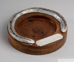 From the Pat Eddery Collection: a racing plate worn by the filly May Hill in 1975, set on a wooden