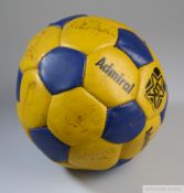 Blue and yellow Admiral leather football autographed by member of the Escape to Victory cast