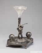 A white metal ink stand depicting a Golfer, circa 1880