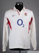White and red England rugby shirt, the reverse bearing numerous player autographs