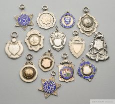 Fourteen various silver or silver and enamel sporting medals, 1899 to 1970