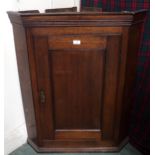 A 19th century oak panel doored corner cabinet, 98cm high x 79cm wide x 42cm deep Condition Report: