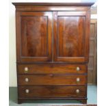 A Victorian mahogany linen press with moulded cornice over pair of panel doors (def) over three long