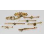 A 15ct gold brooch, weight 2.7gms, and a collection of 9ct gold gem set brooches, weight 13.8gms