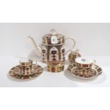 A Royal Crown Derby teapot, a coffee can, saucer and plate, a tea cup and saucer, trinket box and