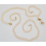 A string of white pearls with an 18ct gold diamond set barrel clasp, each pearl approx 7.6mm, length