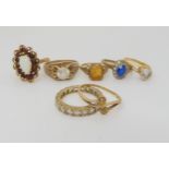 Seven 9ct gold rings all but one gem set, weigh together 22gms Condition Report:Available upon