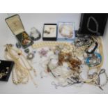 A collection of costume jewellery to include, a glass perfume bottle, a Moon & Star necklace,