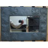 A 20th century arts and crafts embossed lead framed wall mirror, 47cm high x 64cm wide  Condition