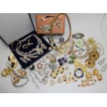 A snake necklace, vintage diamante necklaces and vintage brooches Condition Report:Not available for